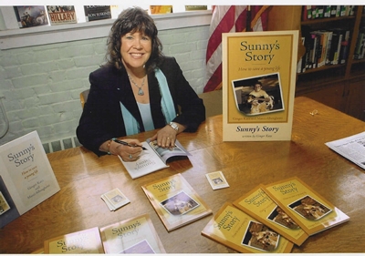 Ginger Katz signing autographed copies of the book.